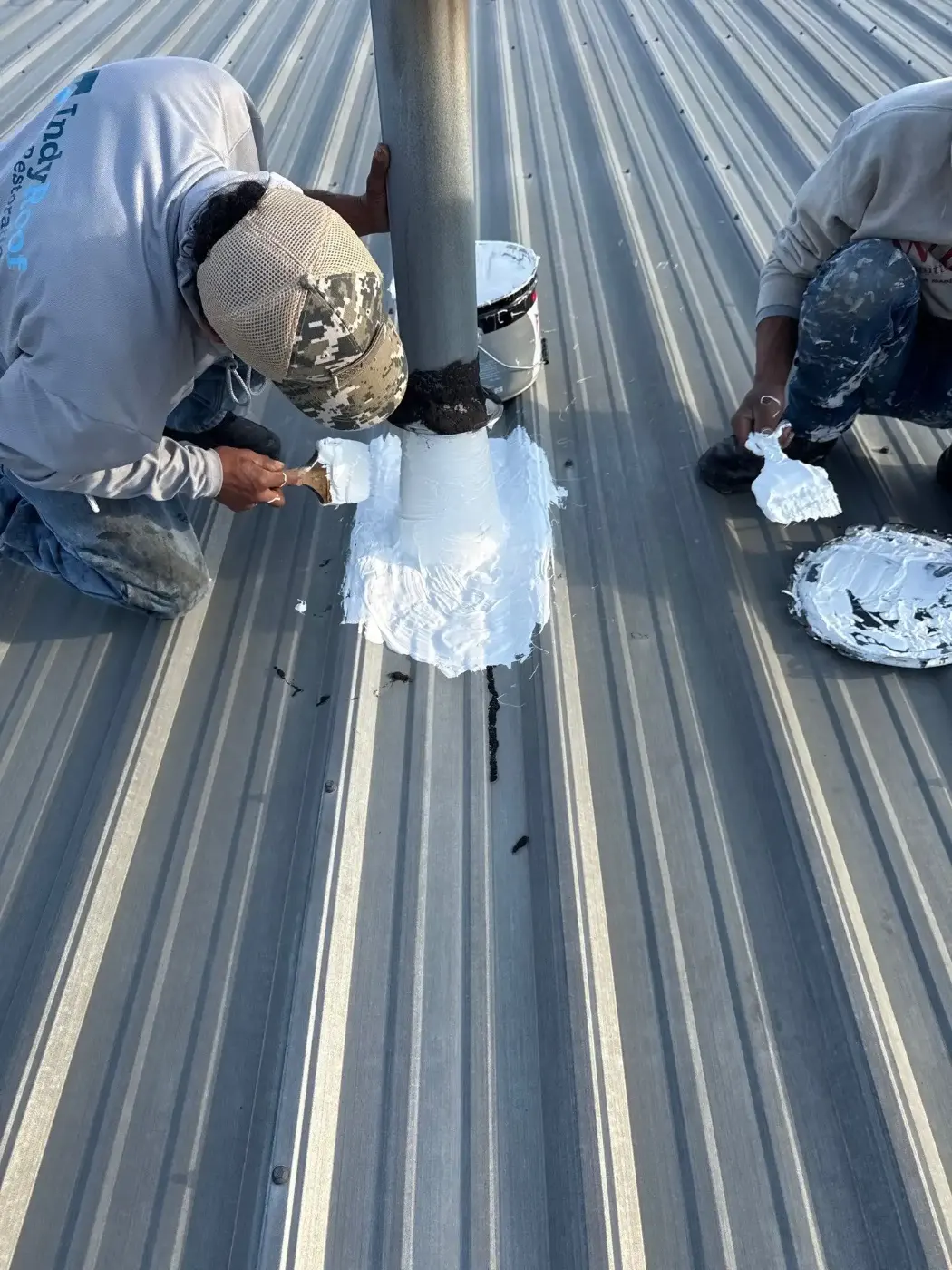 Tarping and dry-in on a Advance commercial roof